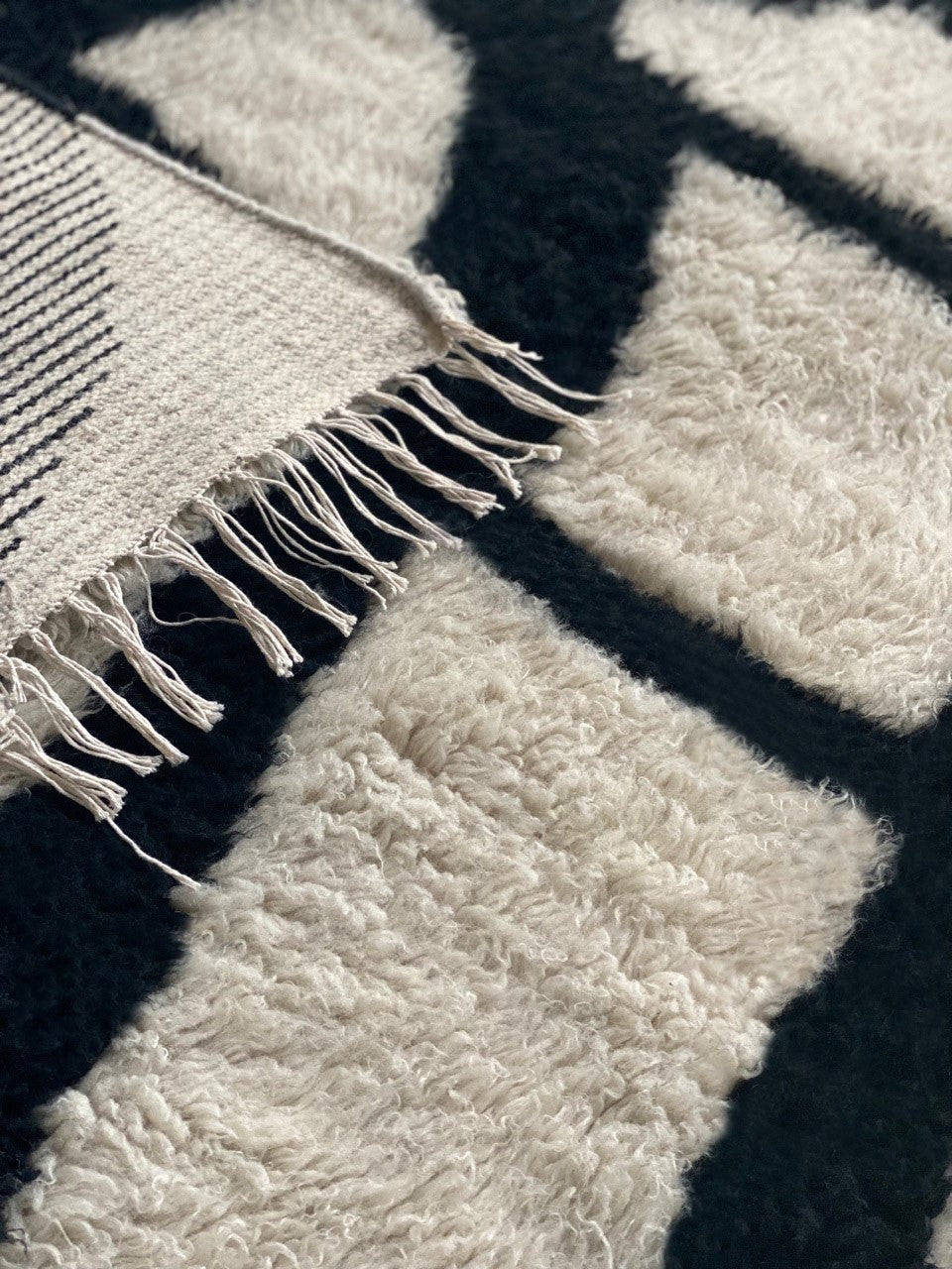 A close-up picture of Running Roots showing the details of the handmade artist rug