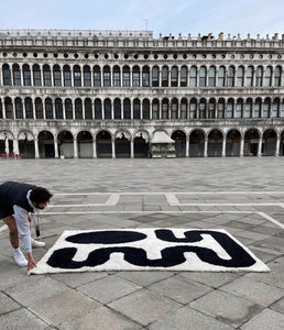 The Saana rug in Venice's St. Mark's square with Philip Rosenberger, the founder of Zakaria Rugs